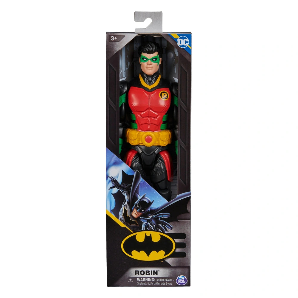 DC Comics Robin action figure stands in a colorful costume inside a packaging box with a clear window and scene design.