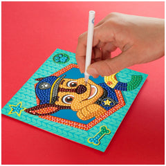 Diamond Dotz Dotzies Paw Patrol Chase diamond painting features a smiling dog character in blue attire with a bone.