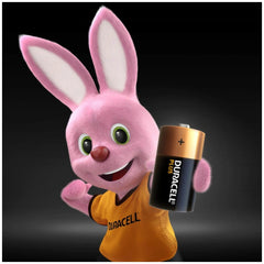 Duracell Plus Power Type C alkaline batteries, yellow with black label, alongside a pink plush bunny with "DURACELL" shirt.