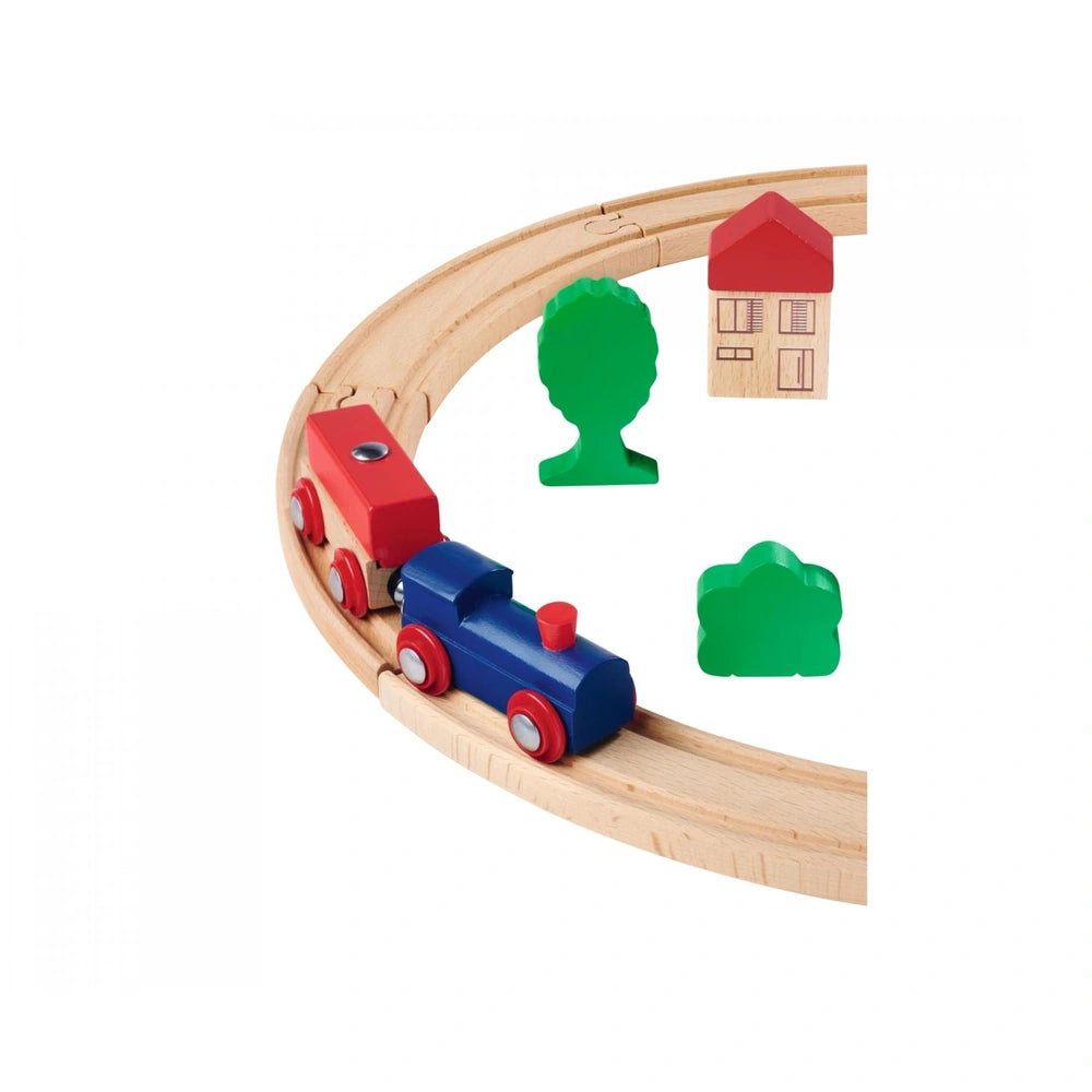 Eichhorn Train Track Playset featuring a blue engine, red cars, a green house, tree, and wooden track for imaginative play.