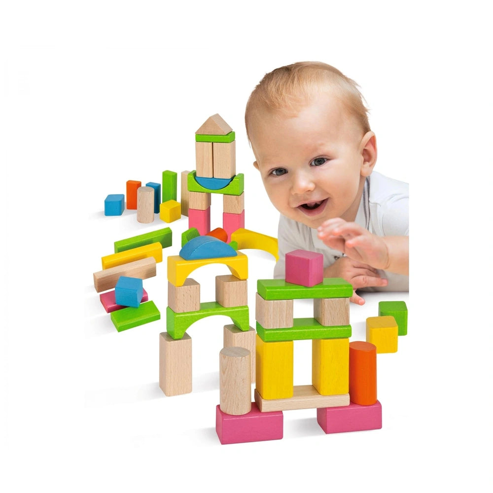 Eichhorn Wooden Blocks - 60 Pcs - A child plays with vibrant geometric toys on a white surface, smiling at the camera.