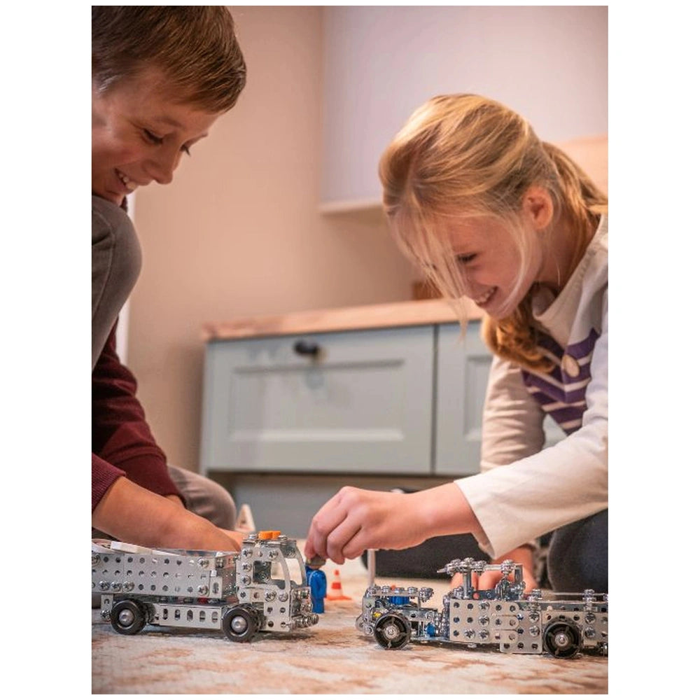 Eitech Speed Racer construction set features a smiling girl and boy holding toy trucks, showcasing playful interaction and jo