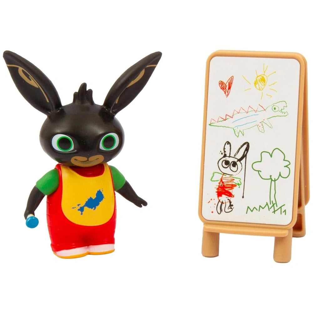 GOLDEN BEAR Lets Paint with Bing toy features a black and brown plush animal on a white cardboard drawing board.