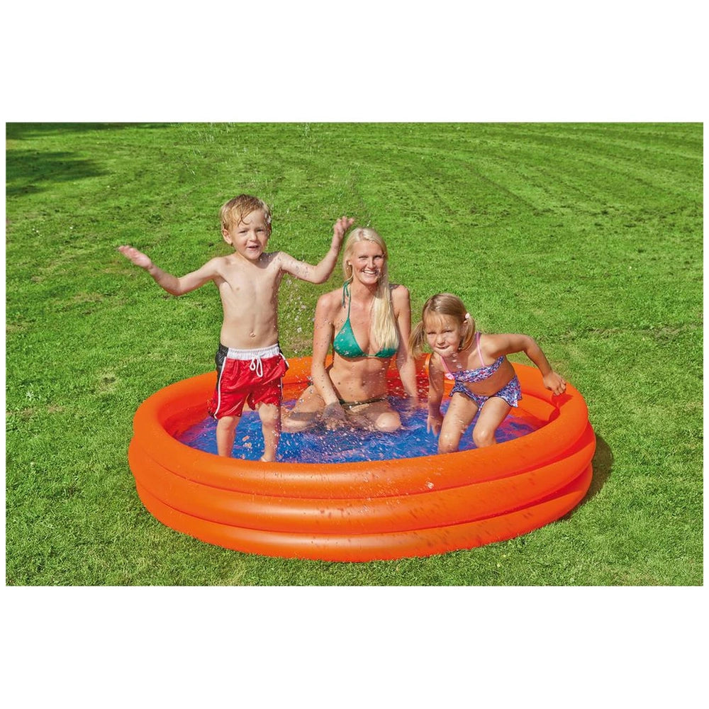 Happy People inflatable pool with orange ring and blue water, featuring a boy, woman, and girl on grass.