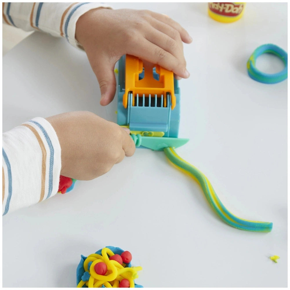 Play-Doh Fun Factory Starter Set featuring a colorful plastic toy car in orange, blue, and yellow with tracks and wheels.