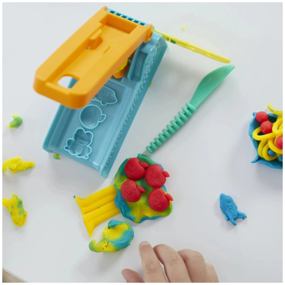 Play-Doh Fun Factory Starter Set featuring four colorful plastic containers with yellow, blue, green, and red lids.
