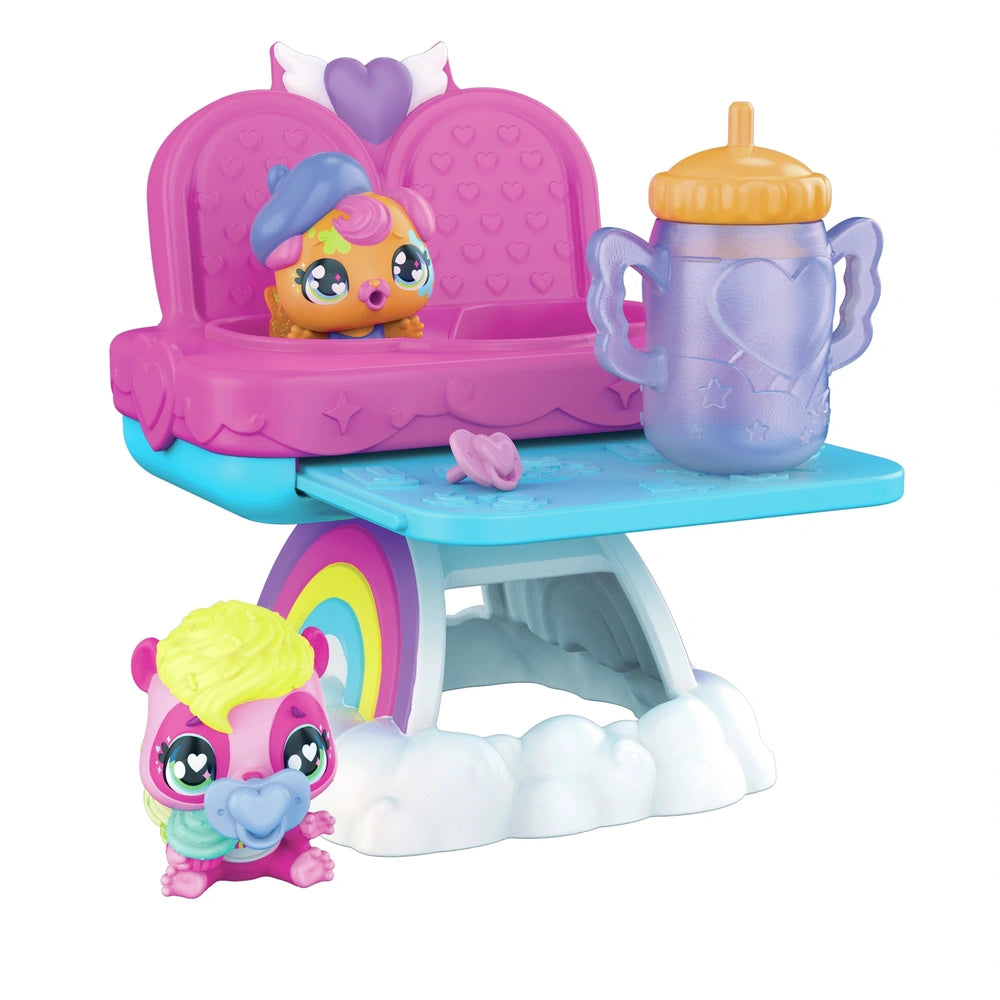 Hatchimals Alive playset features a colorful character in a pink chair with a heart pattern on a blue base beside a white clo