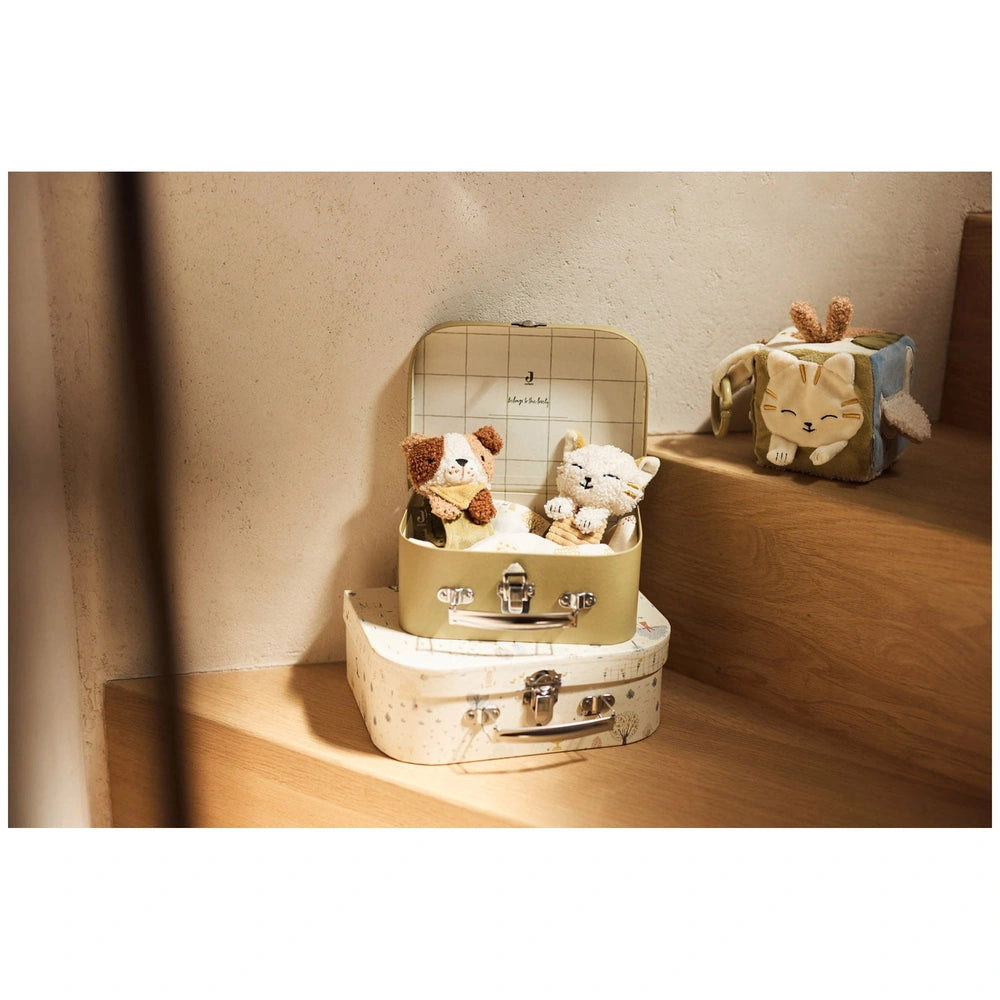 Jollein Wrist Rattle Tiny Park Mick Dog displayed in a lifestyle scene with white walls and a wooden floor.