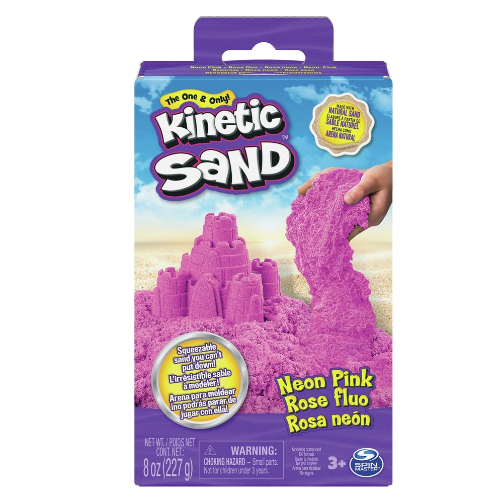 Kinetic Sand Neon packaging features a pink sand castle on a purple background, showcasing vibrant colors and playful design 