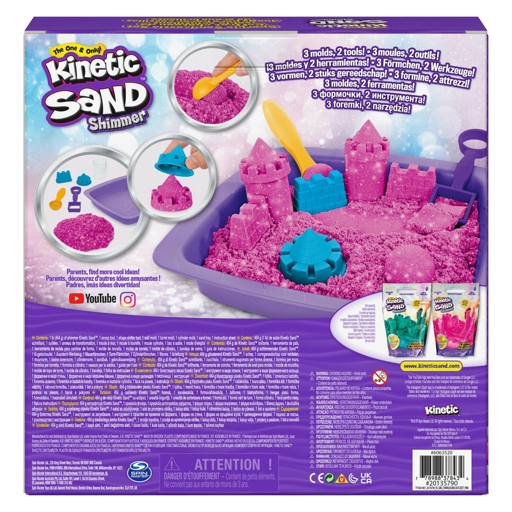 Kinetic Sand Shimmer Sparkle Sandcastle Set features a glittery pink sandbox with a castle structure and yellow shovel.