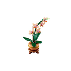 LEGO Mini Orchid construction set featuring five peach blooms, green leaves, and a light terracotta flowerpot on a wooden plinth.