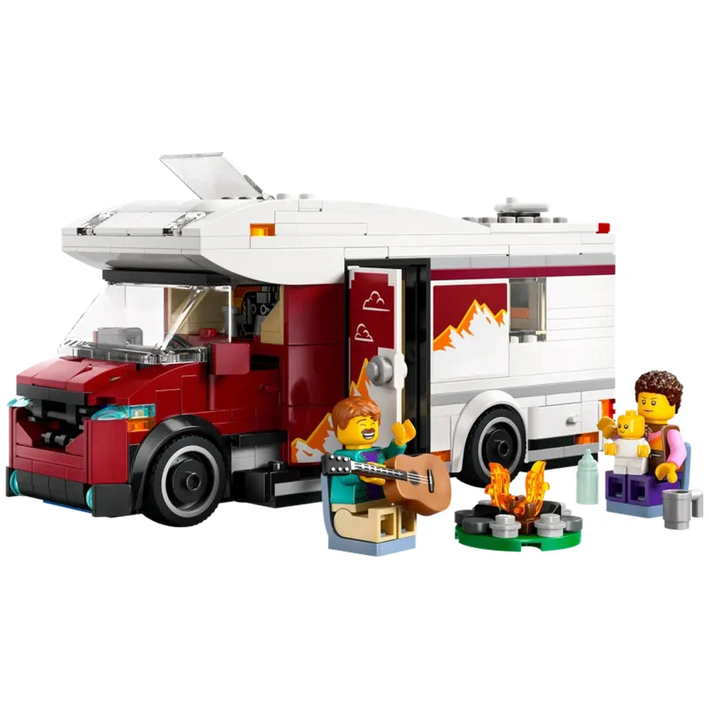 LEGO City Holiday Adventure camper van with two characters, one playing guitar and the other holding a baby, near a campfire.