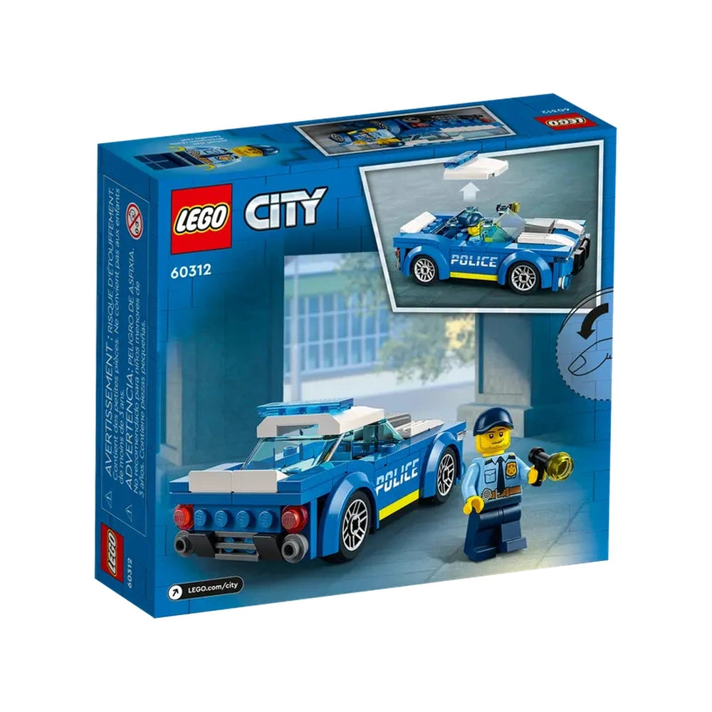LEGO City Police Car construction set featuring a blue police vehicle with a minifigure officer holding a flashlight in a playroom setting.