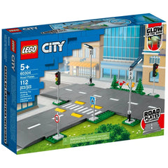 LEGO® City Road Plates construction set featuring four road plates, realistic traffic lights, and a vibrant city background with greenery.