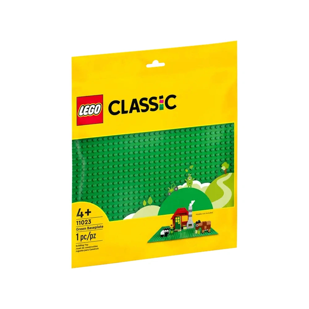 Bright yellow packaging for LEGO Classic Green Baseplate, displaying a lush green baseplate and illustrations of trees, a house, and animals.