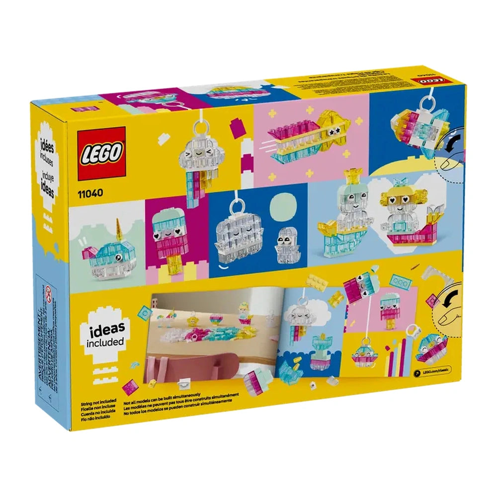 Colorful LEGO® Classic Magical Transparent Box packaging featuring whimsical models like cupcakes, unicorns, and jellyfish on a bright yellow background.