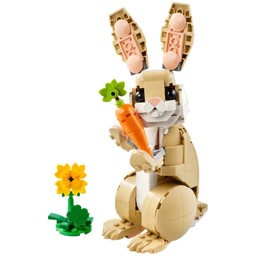 LEGO® Creator 3in1 Cute Bunny set featuring a tan bunny holding a carrot, with a sunflower and green grass beside it.