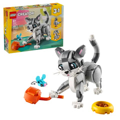 LEGO® Creator 3in1 Playful Cat set featuring a posable gray cat with a pink nose and ears, surrounded by a toy mouse, ball of yarn, and food bowl.
