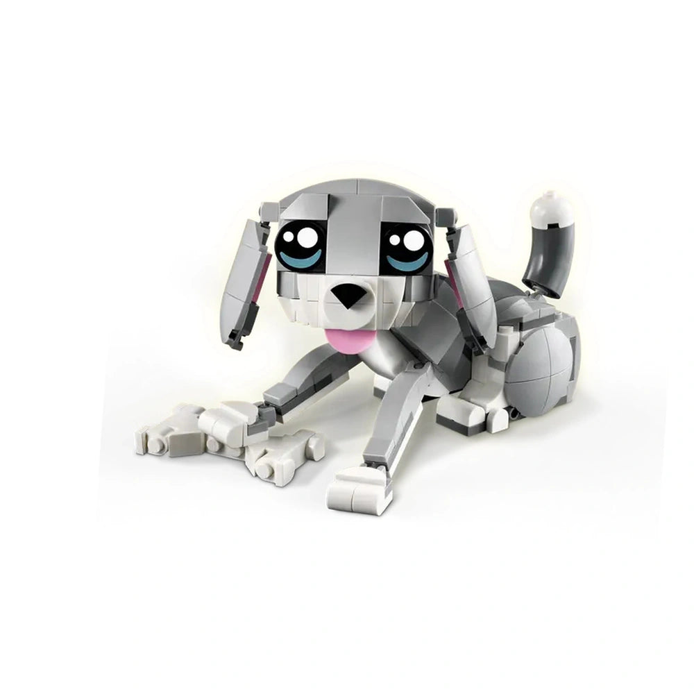 A cheerful gray cat constructed from LEGO bricks, featuring large expressive eyes, a pink tongue, and detailed paws. Accessories include a toy mouse and a ball of yarn, designed for playful interactions.