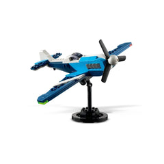 A blue LEGO® Creator 3in1 Race Plane model displayed on a black stand, featuring a rotating propeller, sleek body, and dynamic wings.