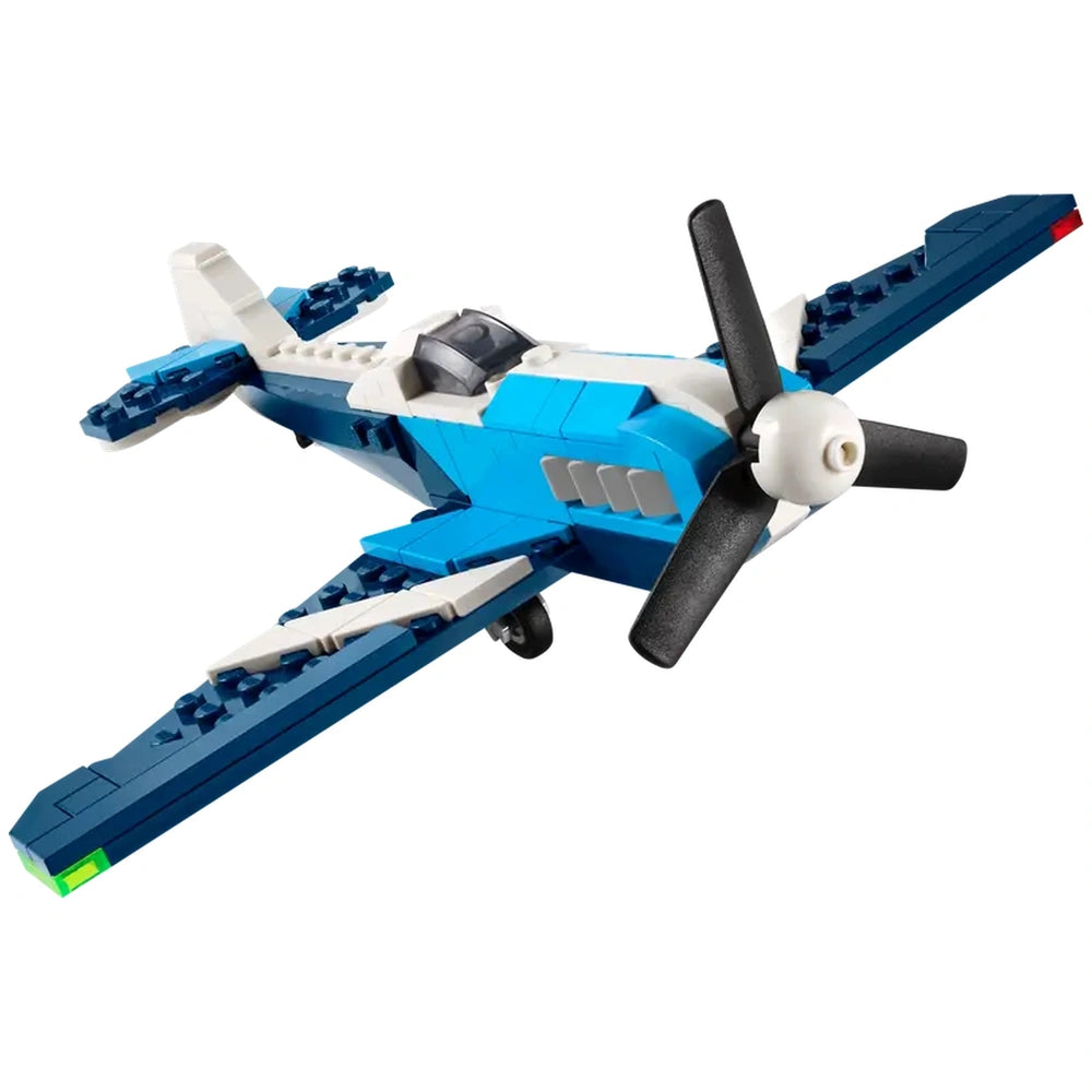 Blue and white LEGO® Creator 3in1 Race Plane, featuring a black rotating propeller, detailed wings, and a transparent cockpit.