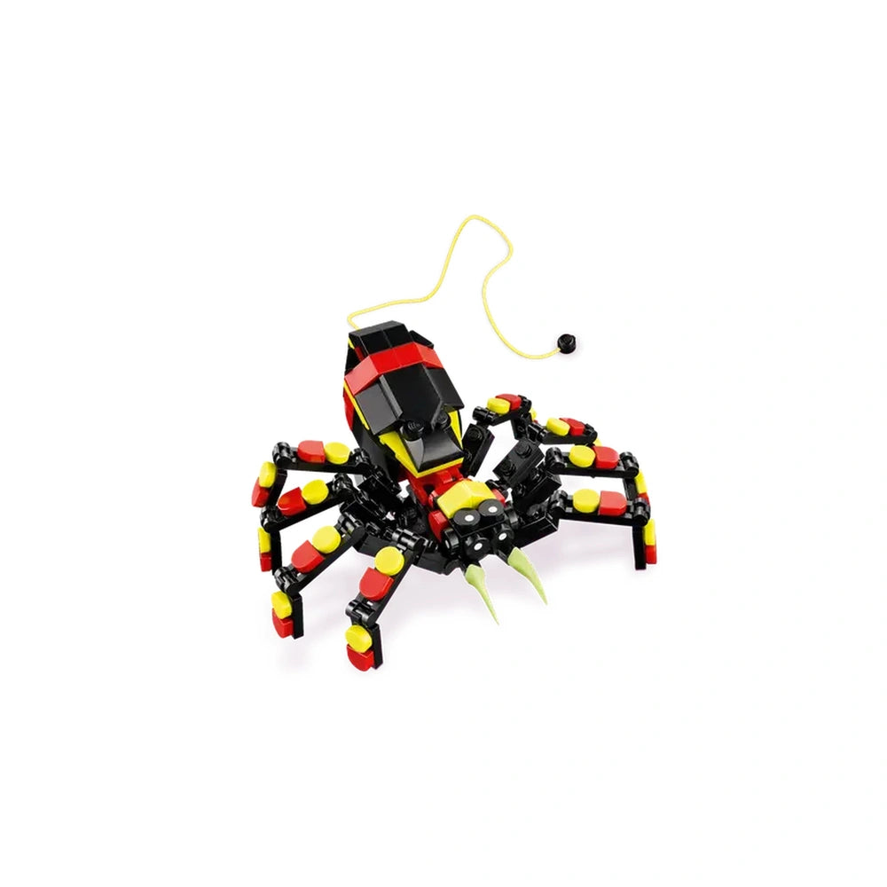 A colorful LEGO Creator Surprising Spider, featuring a black, red, and yellow design, with eight articulated legs and large teeth. A neon-yellow web extends from its back, showcasing its playful and interactive elements.