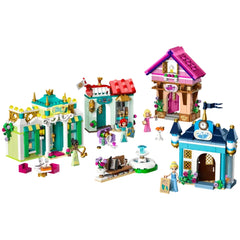 Colorful LEGO® Disney Princess Market Adventure set featuring four detailed buildings, Tiana and Cinderella figures, and various accessories.