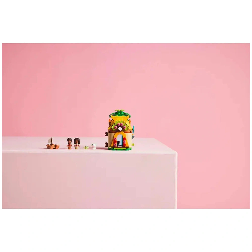 LEGO® Disney Moana’s Island Fun set featuring Moana and her sister Simea micro-doll figures next to a colorful island house and boat.