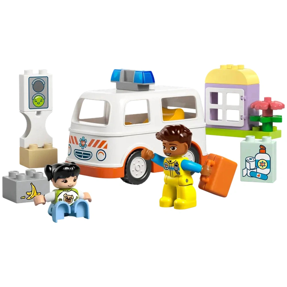 LEGO® DUPLO® Ambulance set featuring a white ambulance, a paramedic with an orange bag, a girl sitting, and colorful play accessories.