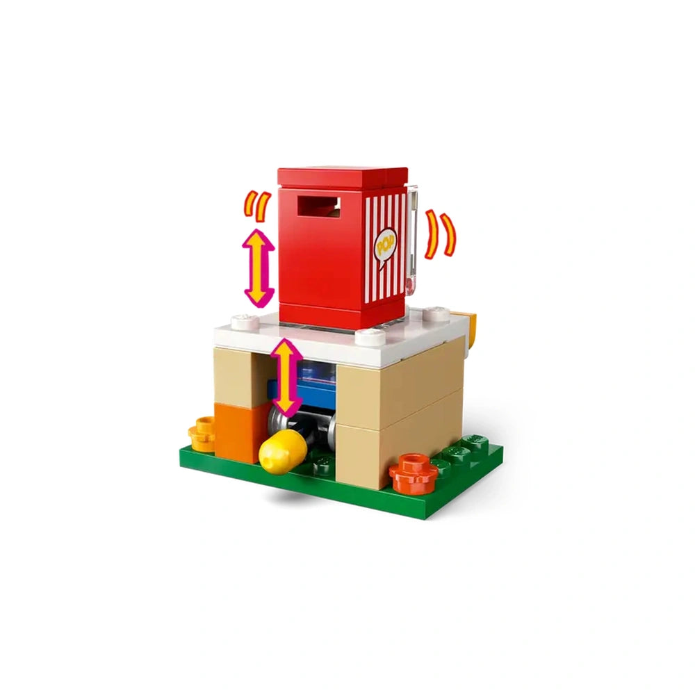 LEGO Friends mini popcorn machine with a bright red popcorn container on top, set on a colorful base with green, orange, and yellow elements.