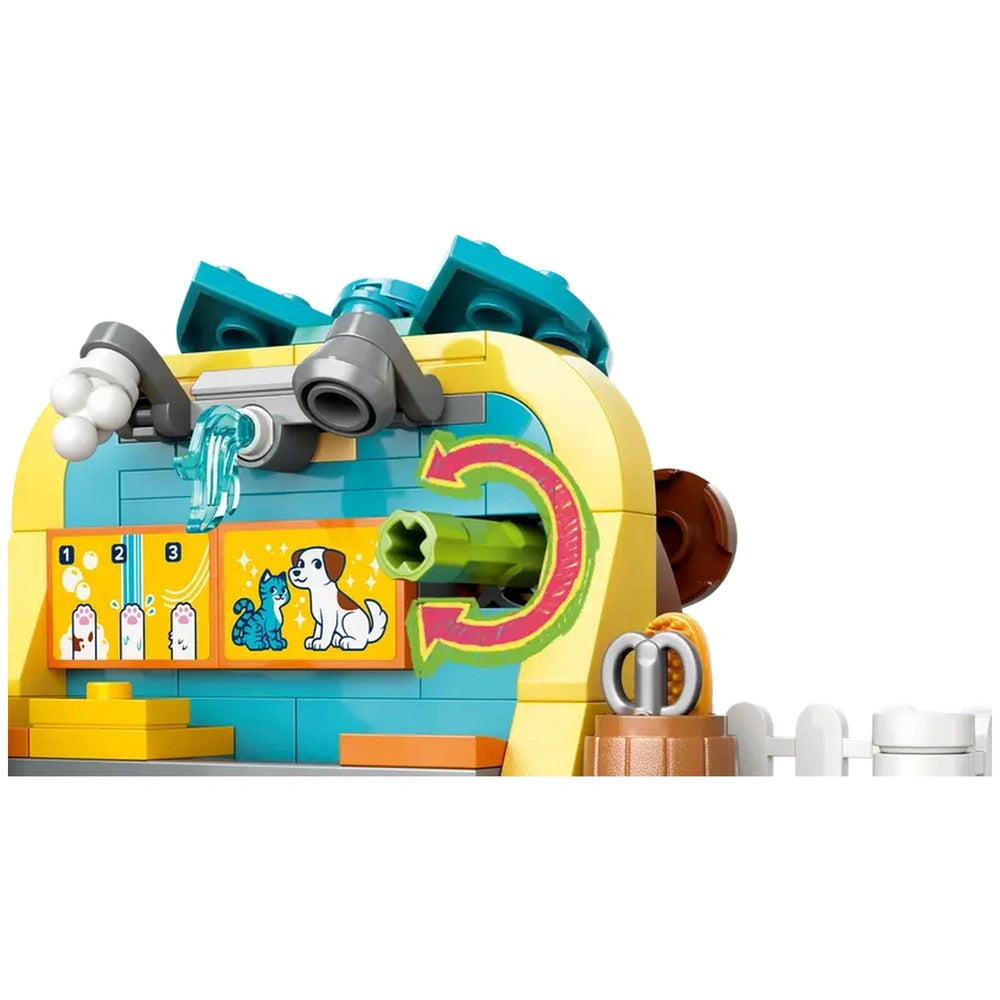 Colorful LEGO® Friends Pet Accessories Shop set showcasing a grooming station with playful pet graphics, a green grooming tool, and fun accessories.