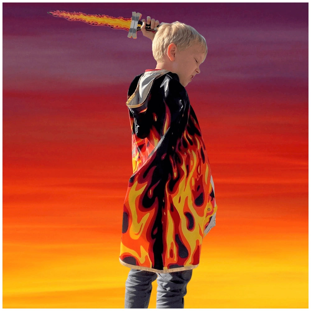 Young child in black flame print jacket holds Liontouch Flame Sword against a vibrant orange and yellow background.