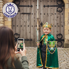 Liontouch Kingmaker Cape worn by a young child in front of a wooden door, featuring green velvet costume elements and a metal