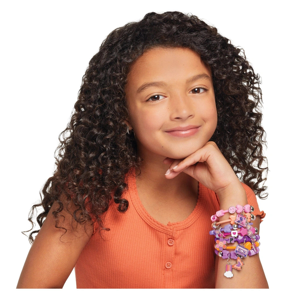 DIY Fashion Beaded Bangle Bracelets displayed on a person with dark curly hair and an orange shirt, showcasing multicolored d