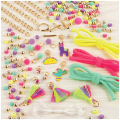 MAKE IT REAL Neo-Brite chains and charms featuring various gold-colored accessories like clips, rings, and clasps arranged ce