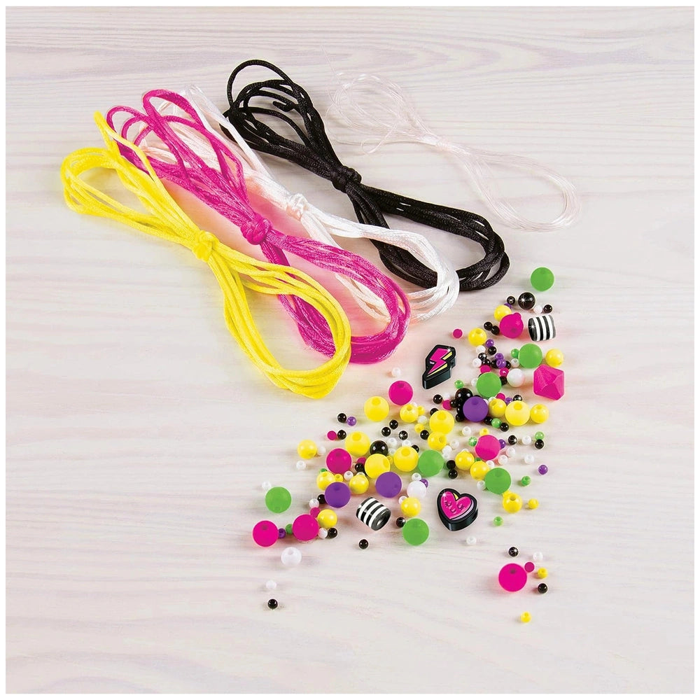 Neon Retro Bracelets featuring pink, yellow, black, and white strings, various colorful beads, and small plastic pieces on a 