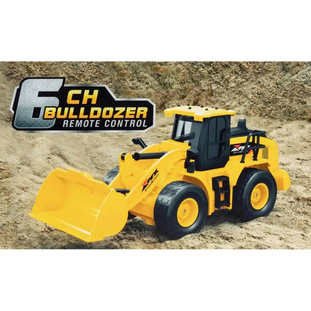 Mondo Motors RC-MX Bulldozer in yellow on brown sand, featuring a large bucket, black seat, and wheels.
