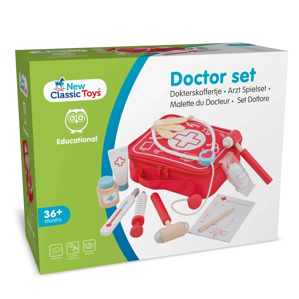 New Classic Toys Doctor Set in red with stethoscope, thermometer, syringe, and first aid kit, packaged in green matte cardboa