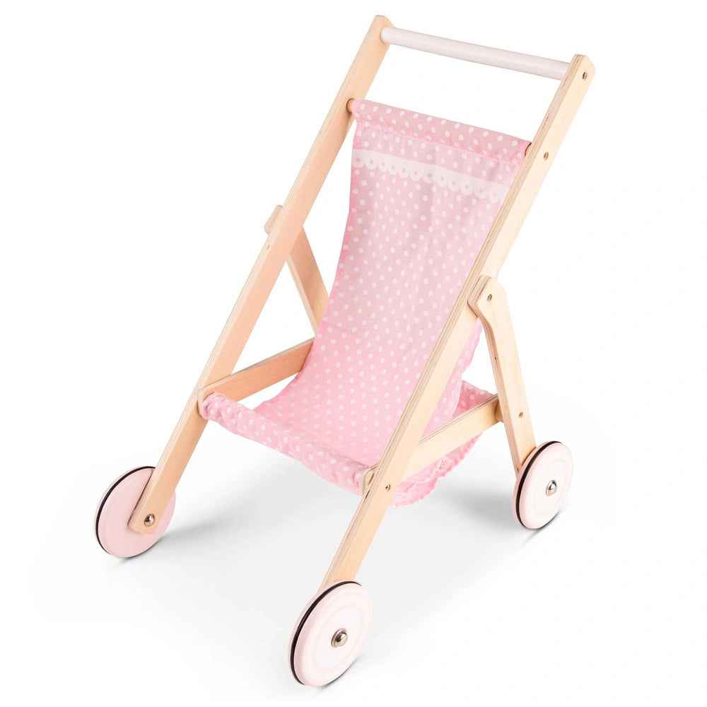 Doll stroller features a wooden frame, pink polka dot fabric seat, and pink plastic wheels, ideal for pretend play.