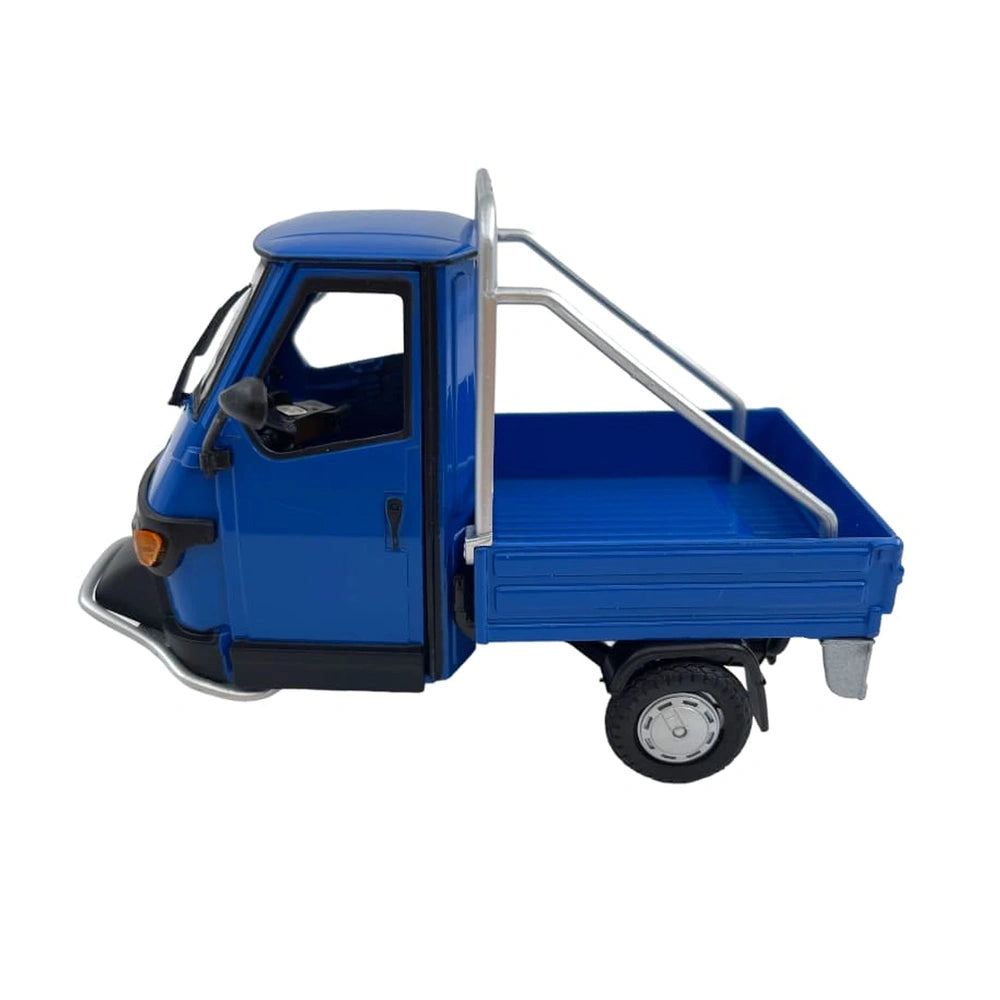 glossy blue Piaggio Ape 50 Cross Country die-cast model with black wheels, orange headlights, and metallic roof rack.