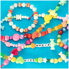 Beads ABC Candy Beads Jar featuring colorful plastic beads and bracelets with "NICE" and "MAGIA" lettering.