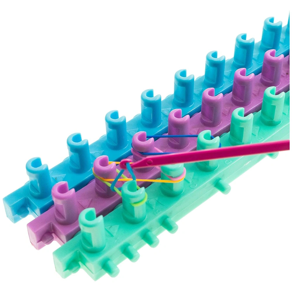 Creative Elasticolor craft set featuring interlocking plastic components in blue, purple, green, and pink with a pink rod.