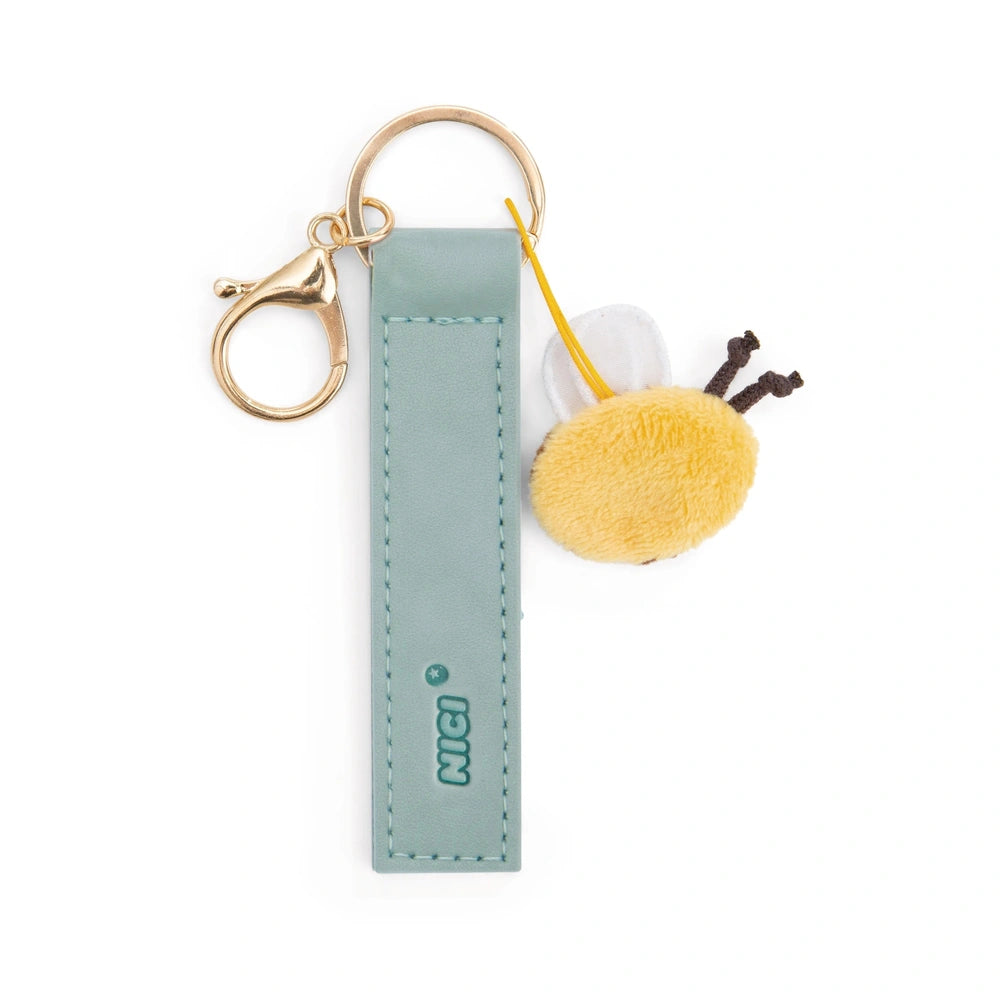 Bee Happy keyholder features a gold keychain with "MICI" embossed, attached to a blue leather strap and yellow plush toy.