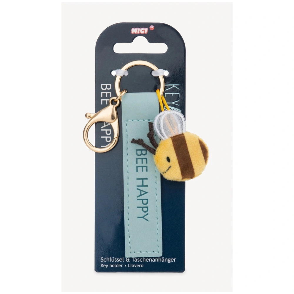 Bee Happy keyholder featuring a plush bee charm, metallic keychain, and glossy text on blue matte cardboard packaging.
