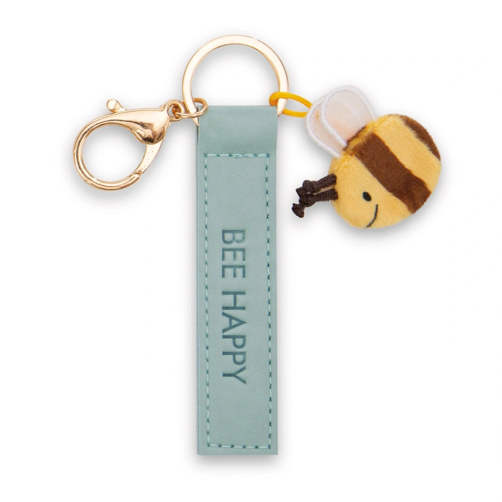 Bee Happy keyholder features a light blue fabric tag with a stitched edge, attached to a plush yellow and brown bee charm.