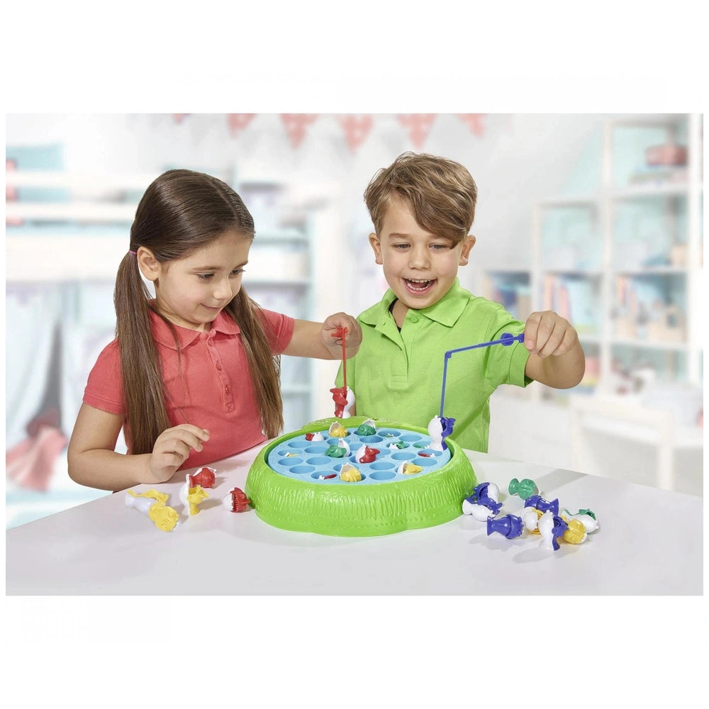 Noris Fishing Game board game features children engaging with colorful components at a table in a bright indoor setting.