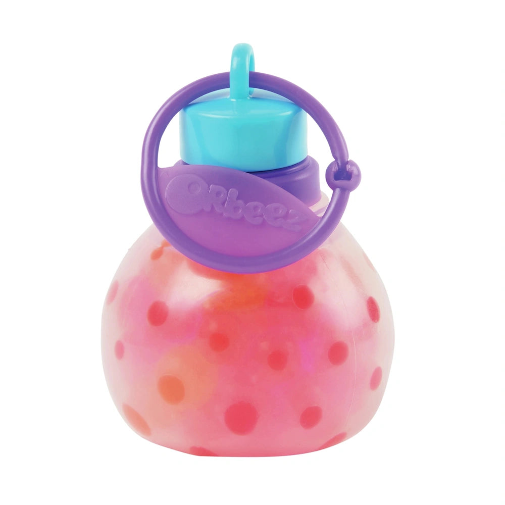Orbeez Water Beads Surprise Activity Orb Set features a pinkish orb with red dots, a blue cap, and a purple handle.