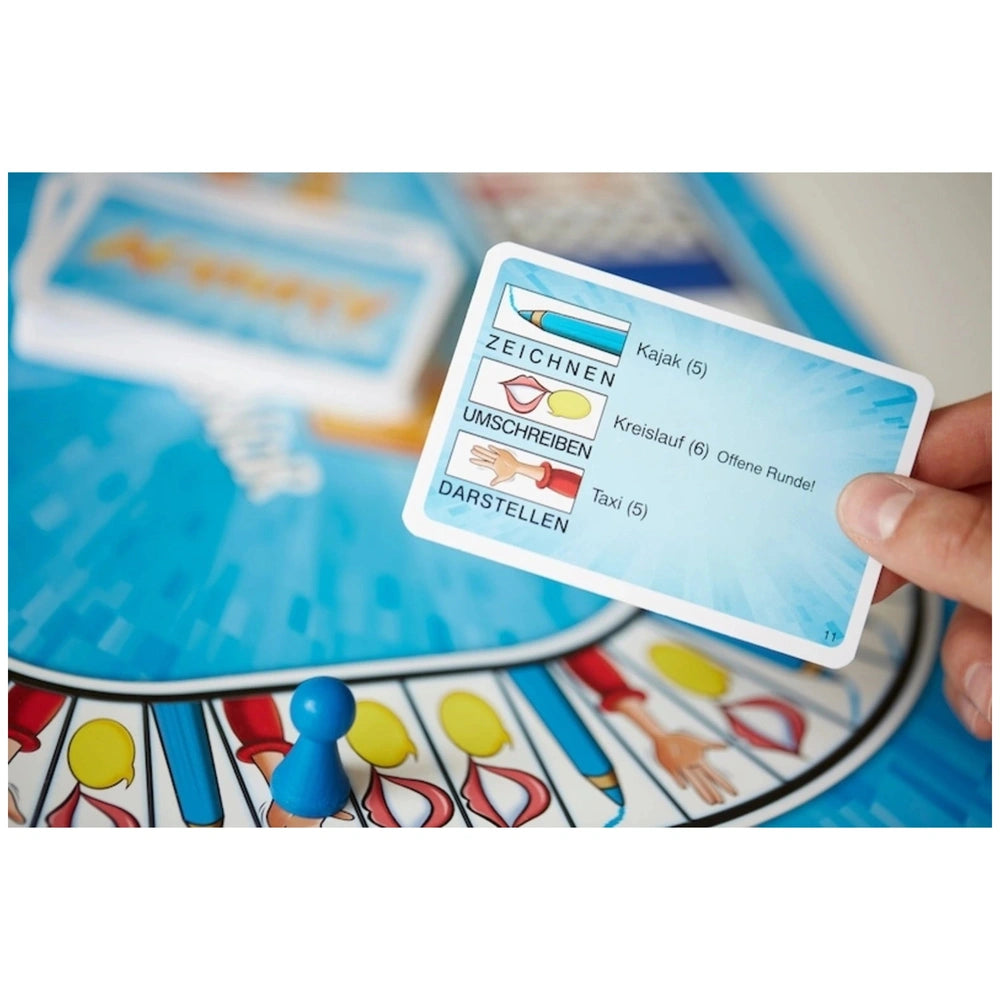 PIATNIK Activity Junior board game features a light blue plastic surface with circular icons and a central button.