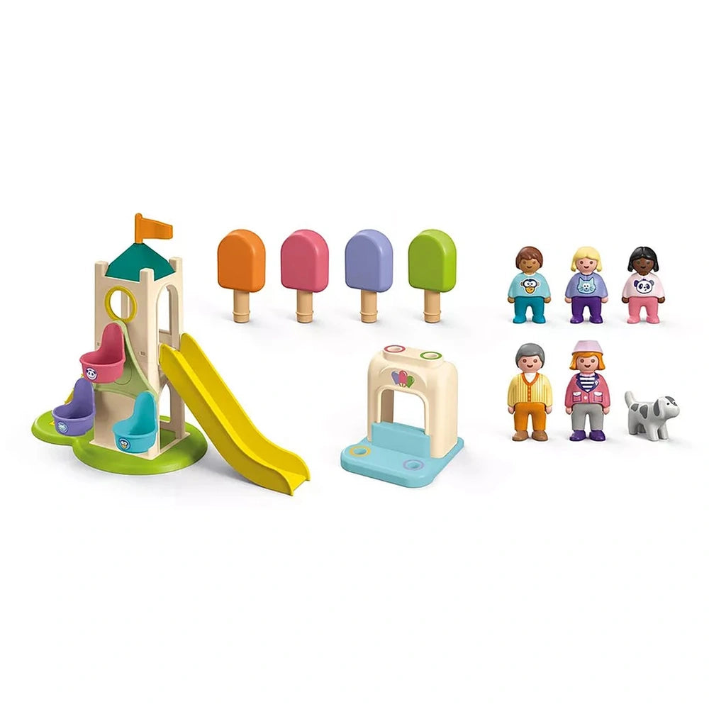 Playmobil Adventure Tower with colorful slides and ice cream booth featuring wooden and plastic components.