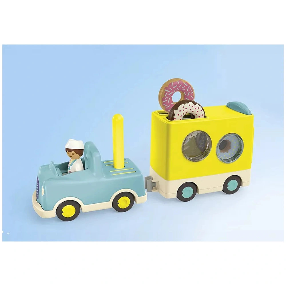 Playmobil Crazy-Donut-Truck features a yellow and blue plastic design with black wheels and glossy windows, perfect for imagi